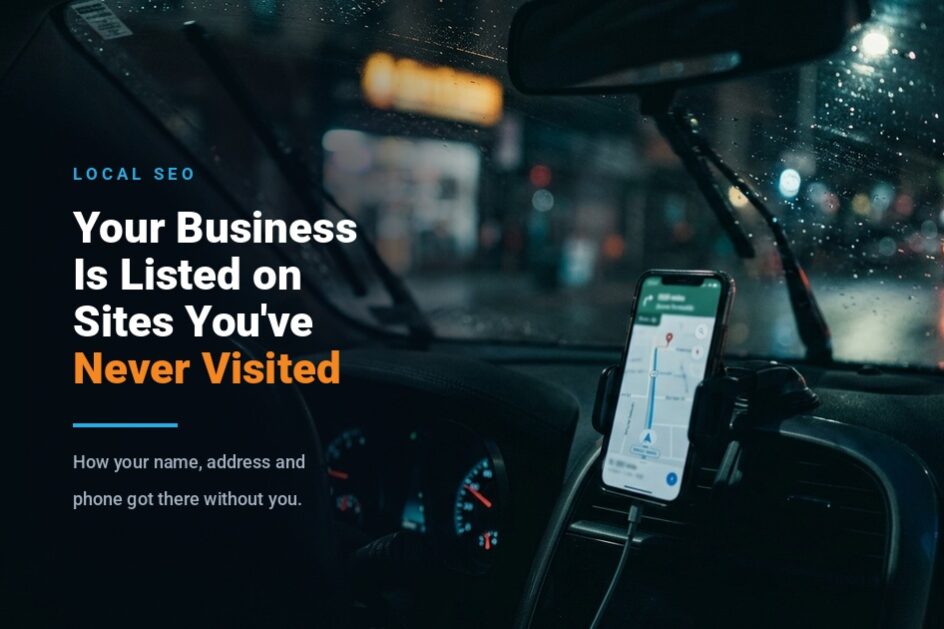 Phone mounted on a car dashboard at night showing a navigation map, with a rainy street and storefront lights blurred through the windshield
